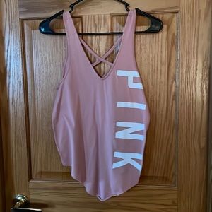 Size XS PINK pink tank top. V neck on the back and front with criss cross detail